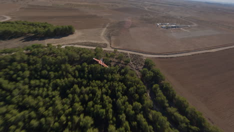 RC-plane-maneuvers-flying-next-to-airstrip
