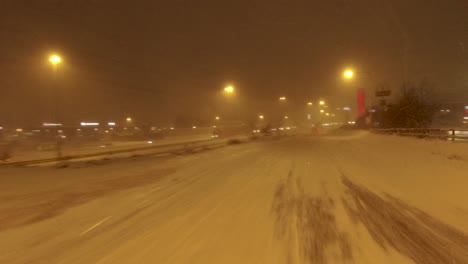 POV-shot-traveling-through-thick-snow-on-a-highway-in-Helsinki,-Finland