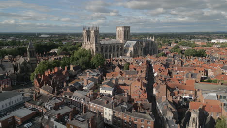 Establishing-Aerial-Drone-Shot-of-Old-Iconic-Roman-British-City-Centre-York-with-Old-Buildings-Flying-Towards-Famous-York-Minster-Cathedral-North-Yorkshire-UK