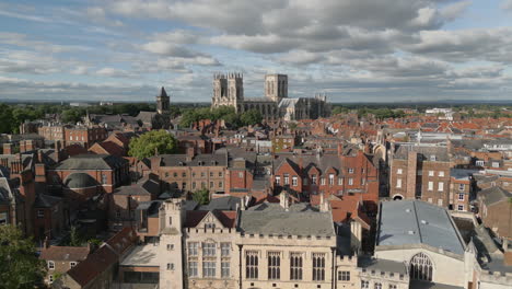 Establishing-Aerial-Drone-Shot-of-Old-Iconic-Roman-British-City-Centre-York-with-Old-Buildings-and-Famous-York-Minster-Cathedral-in-Background-North-Yorkshire-UK
