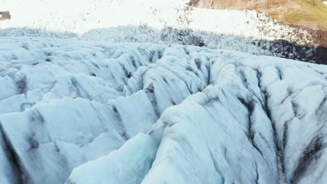 Jagged-cracked-surface-of-Virkisjökull-glacier-in-Iceland,-aerial