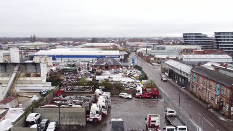 Aerial-view-across-backstreet-city-industrial-truck-yard-mechanics-workplace
