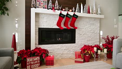 Calgary,-Alberta---December-10,-2022:-A-gas-fire-burns-in-a-beautifully-decorated-fireplace-in-a-modern-home-at-Christmas-time