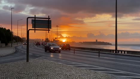 Aerial-view-of-heavy-traffic-in-marginal-avenue-during-sunrise-in-Cascais
