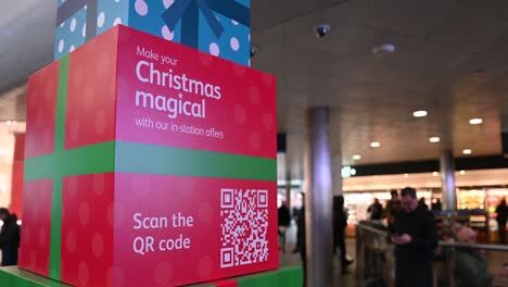 Be-sure-to-scan-and-make-your-Christmas-magical,-Kings-Cross-Station,-London,-United-Kingdom