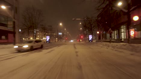 POV-shot-traveling-through-the-snowy-streets-of-Helsinki-with-people-walking