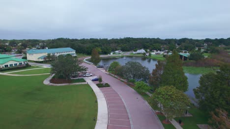 Aerial-flyover-of-Starke-Lake-and-the-charming-and-quaint-city-of-Ocoee,-Florida