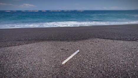 Plastic-Tube-Waste-On-The-Sandy-Seashore-Of-Bali-Beach,-Indonesia