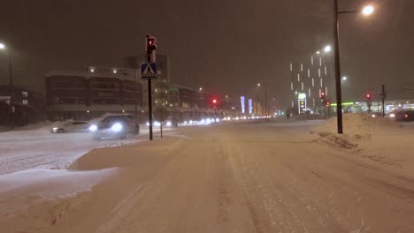 POV-shot-waiting-at-traffic-lights-with-pedestrians-crossing-in-front-in-Helsinki