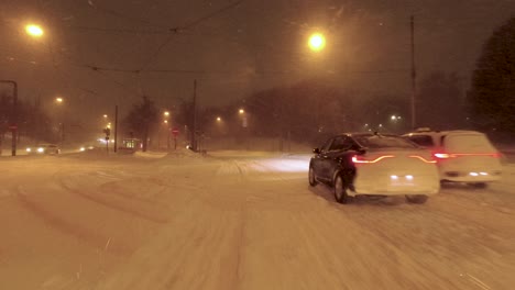 POV-shot-driving-under-bridges-and-stopping-at-traffic-lights-in-a-snowy-Helsinki
