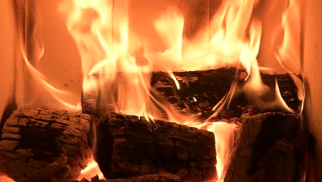 close-up-of-fireplace-at-rustic-home-burning-woods-for-heat-the-house