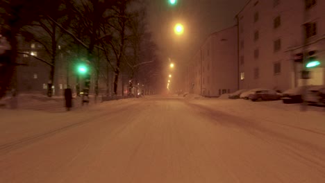 POV-shot-driving-through-the-snowy-roads-in-Helsinki-and-stopping-at-traffic-lights