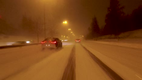 Driving-along-a-snowy-highway-in-Helsinki-with-very-poor-visibility