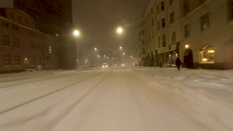POV-shot-traveling-through-a-snowstorm-in-downtown-Helsinki,-Finland