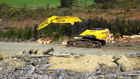 Close-up-of-log-loader-stopped-in-deforestation-area,-New-Zealand