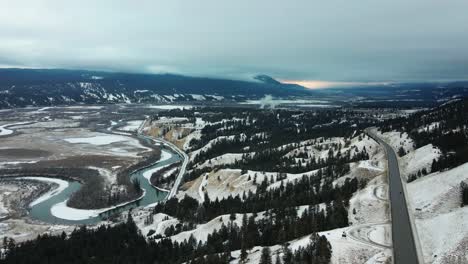 Aerial-Riser-Shot-of-Panoramic-Scene-of-Spectacular-Winter-Landscape:-View-of-Cariboo-Highway-95-and-Snow-Covered-Sand-Banks-Along-Columbia-Riverbanks