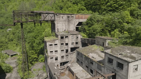 Concrete-buildings-and-rusty-cableway-platform-of-abandoned-factory