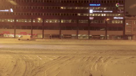 POV-turning-shot-following-signs-in-a-snow-covered-Helsinki,-Finland