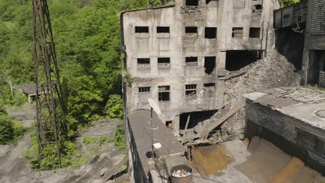 Pile-of-rubble-between-desolate-buildings-of-abandoned-Chiatura-mine