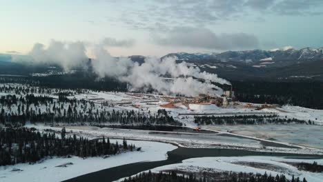 Pulp-Mill-in-Action:-Aerial-View-of-Industrial-Facility-in-Cranbrook,-British-Columbia-Processing-Raw-Materials-for-Paper-Production-on-a-Winter-Morning