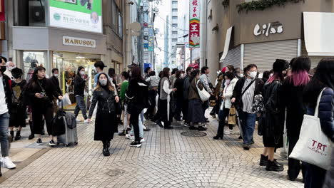 Crowd-of-People-Downtown-at-Shopping-Crossing-Street,-Osaka,-Japan
