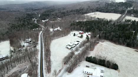 A-drone-shot-in-VT-showing-the-roads-covered-in-snow