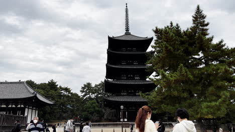 Tourists-at-Traditional-Buddhist-Pagoda-in-Nara,-Japan
