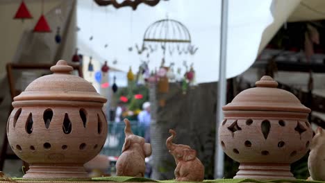 Garden-ornaments-on-display-at-the-annual-flower-market-in-Meran,-South-Tyrol,-Italy
