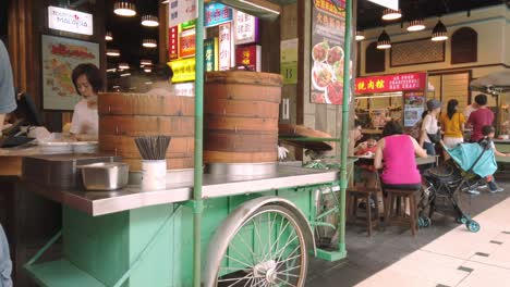 A-bun-cart-selling-dimsum-in-front-of-a-busy-food-court