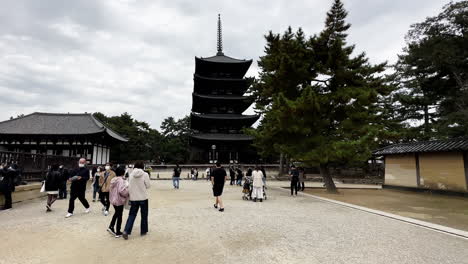 Tourist-Walking-in-Front-of-Pagoda,-Travel-Destination-Concept,Nara,-Japan