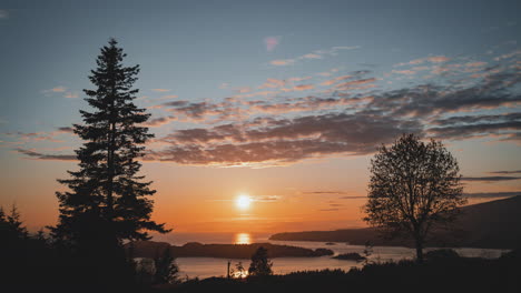 Timelapse-of-vivid-colours-of-a-warm-sunset-or-sunrise-of-islands-and-oceans-in-Bowen-Island,-British-Columbia,-Canada