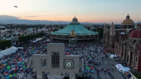 Aerial-view-over-the-Carrillon-towards-the-Basilica-of-Our-Lady-of-Guadalupe,-Pilgrimage-Virgin-Day-evening-in-Mexico