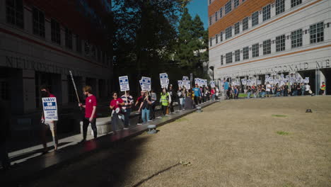 A-Wide-Shot-of-UC-Academic-Workers-on-Strike-with-a-Long-Picket-Line-and-Signs