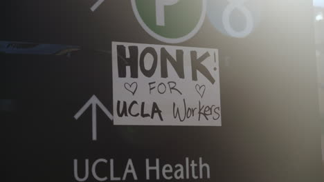 A-Sign-that-Says-"Honk-for-UCLA-Workers,"-at-the-UC-Academic-Workers-Strike-at-UCLA