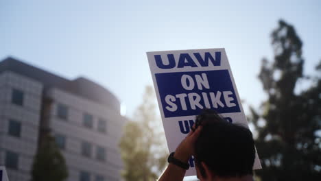 :-A-"UAW-On-Strike,"-Sign-Held-High-on-the-Picket-Line-at-the-UC-Academic-Workers-strike-at-UCLA