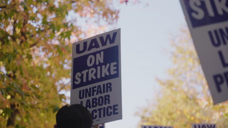 A-UAW-On-Strike-Sign-Held-High-at-the-UC-Academic-Workers-Strike-Picket-Line