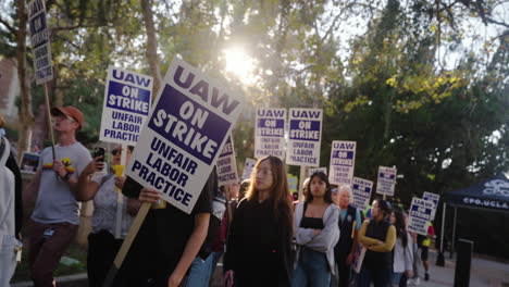 A-Large-Line-of-Academic-Workers-on-Strike-March-on-UCLA's-Campus-with-Signs-at-Golden-Hour