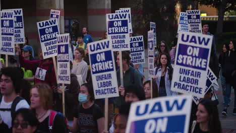 A-Slow-Motion-Pan-of-a-Large-Crowd-of-Academic-Workers-with-Signs-Marching-on-UCLA's-Campus