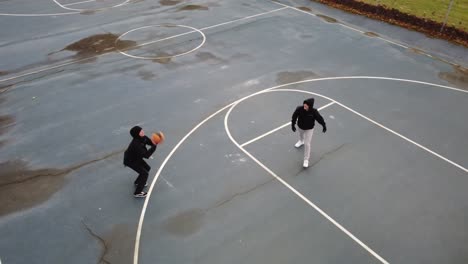AERIAL:-Drone-shot-of-a-basketball-game-at-the-park