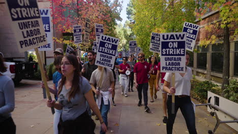 A-Large-Crowd-of-UC-Academic-Workers-on-Strike-at-UCLA-March-on-Campus-with-Fall-Colors-in-the-Background