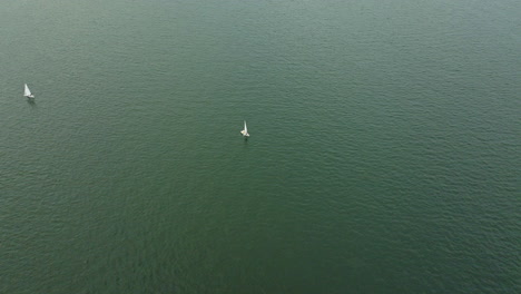 Aerial-Drone-shot-of-sailing-tourism-Boat-on-the-water-in-Hong-Kong,-China