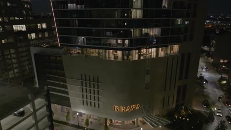 Aerial-view-around-the-Brava-luxury-residence,-nighttime-in-Houston,-Texas,-USA