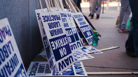 Picket-Signs-Leaning-Against-a-Wall-at-the-UC-Academic-Workers-Strike-at-UCLA