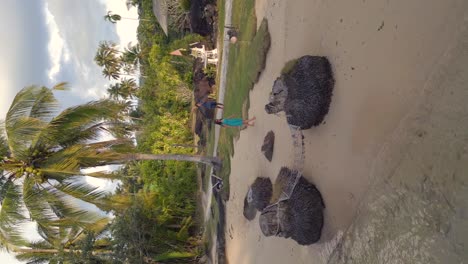 Woman-walking-barefoot-on-sandy-beach