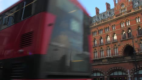 Traffic-Driving-In-The-Street-Along-The-St-Pancras-International-With-Victorian-Building-In-London,-UK