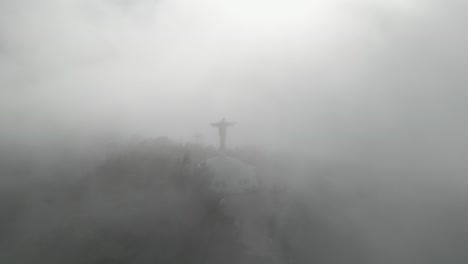 AERIAL:-Drone-shot-of-the-Christ-the-Redeemer-satue-surrounded-by-clouds
