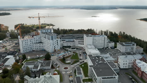 Aerial-Orbit-establishing-shot-of-Vaasa-region-hospital,-Ostrobothnia,-Finland