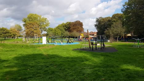 Exercise-equipment-and-playground-facilities-in-Southall-Recreation-Ground,-Southall,-Middlesex
