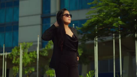 Young-latina-in-business-attire-enjoy-a-day-in-the-city-on-a-sunny-day