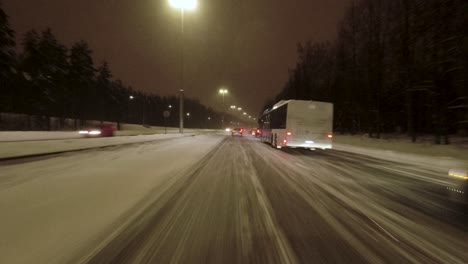 POV-shot-driving-in-heavy-traffic-in-Helsinki-after-a-heavy-snowfall